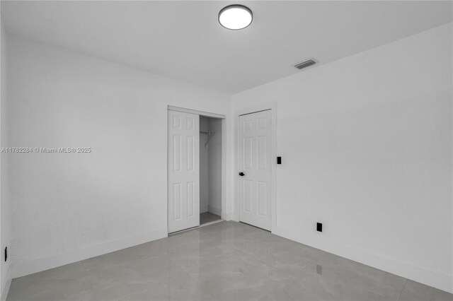 1000 NW 198th St, Miami Gardens, FL 33169 - unfurnished bedroom with a closet, visible vents, and baseboards