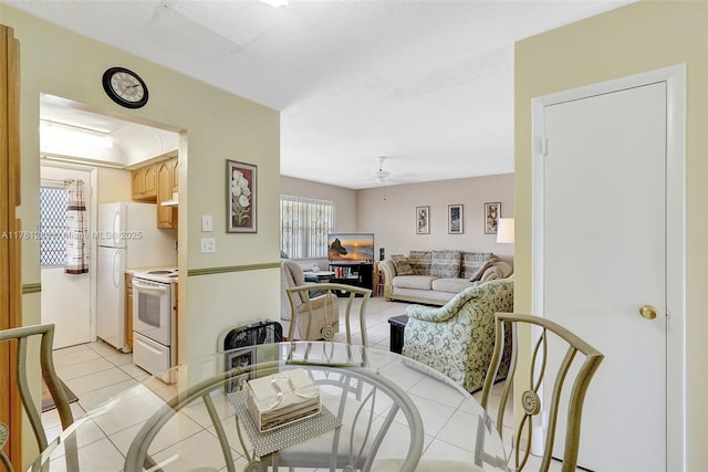 living room with light tile patterned floors and ceiling fan