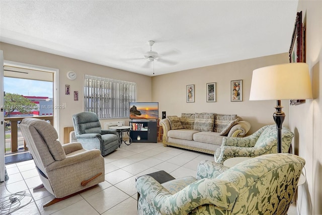 living room featuring ceiling fan and light tile patterned floors