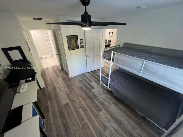 bedroom with dark wood-style flooring and ceiling fan