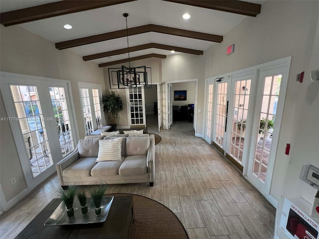 living area with recessed lighting, french doors, light wood-type flooring, and lofted ceiling with beams