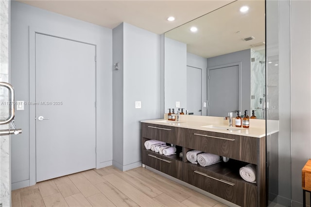full bathroom featuring recessed lighting, visible vents, and vanity