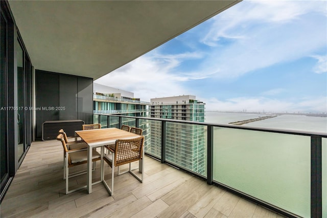 balcony featuring a water view