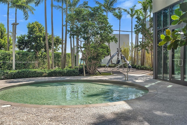 view of pool featuring a fenced in pool and a patio area