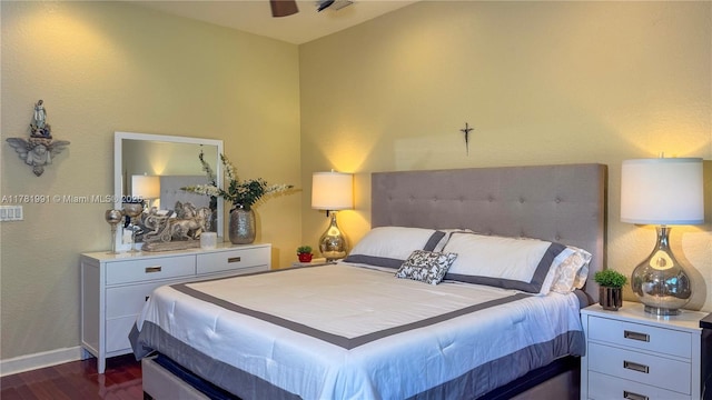bedroom featuring baseboards and dark wood finished floors