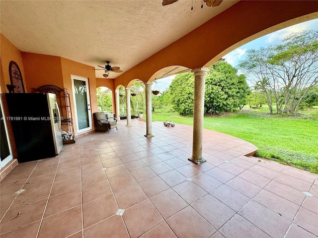 view of patio featuring a ceiling fan