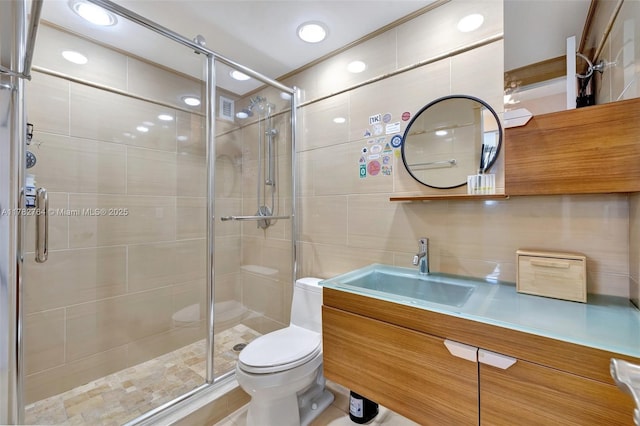 3001 S Ocean Dr Unit 1507, Hollywood, FL 33019 - bathroom featuring toilet, vanity, a shower stall, and recessed lighting