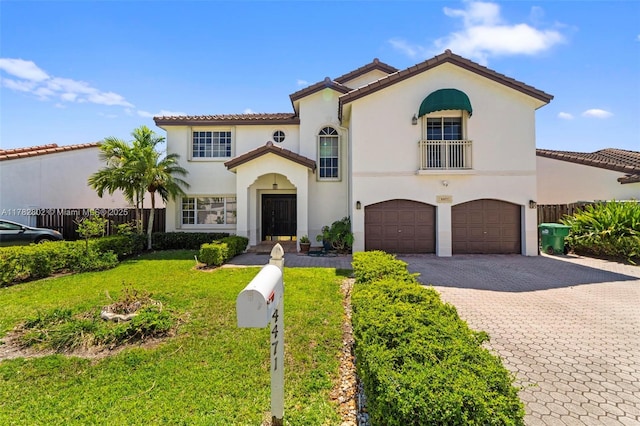 4471 SW 154th Ct, Miami, FL 33185 - mediterranean / spanish home with an attached garage, decorative driveway, stucco siding, and a tiled roof