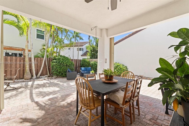 view of patio / terrace with outdoor dining area and fence