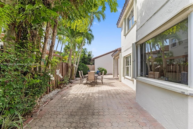 view of patio / terrace with a fenced backyard and outdoor dining space