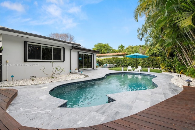outdoor pool featuring a patio area