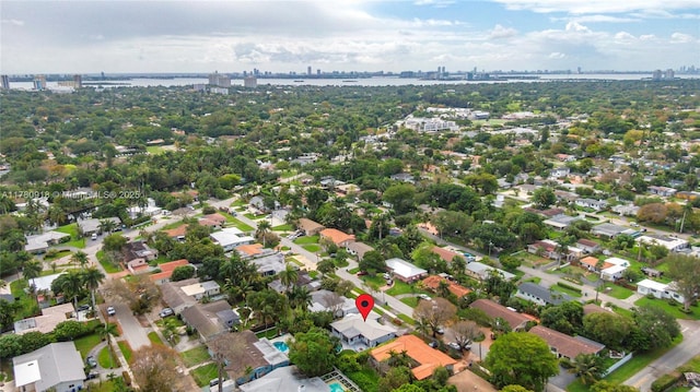 birds eye view of property featuring a view of city and a water view