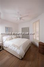 bedroom with wood finished floors and ceiling fan