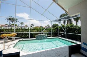 pool with a lanai and a patio