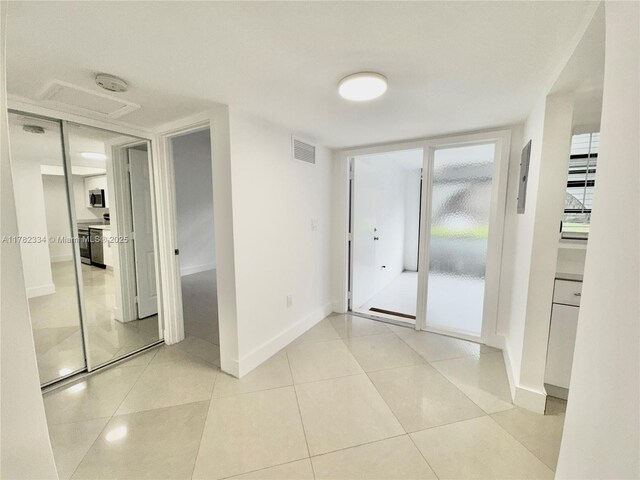interior space with baseboards and visible vents