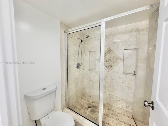 full bath with toilet and a stall shower