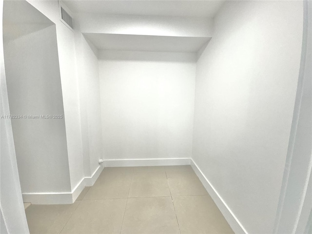 spacious closet with light tile patterned floors and visible vents