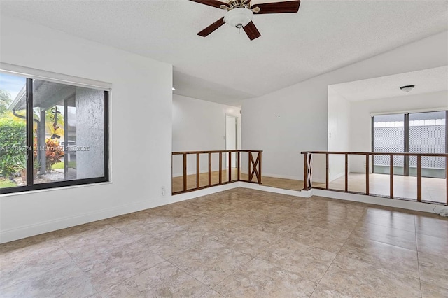 971 NW 89th Ave, Plantation, FL 33324 - spare room with a wealth of natural light, a ceiling fan, and baseboards