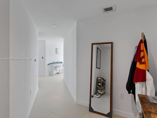 1300 S Miami Ave Unit 2001, Miami, FL 33130 - hallway featuring light tile patterned floors and baseboards