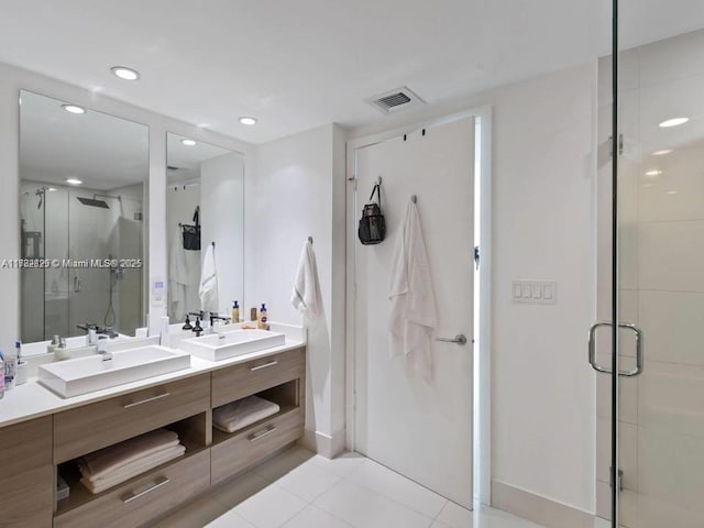 1300 S Miami Ave Unit 2001, Miami, FL 33130 - full bathroom with double vanity, a stall shower, tile patterned flooring, and recessed lighting