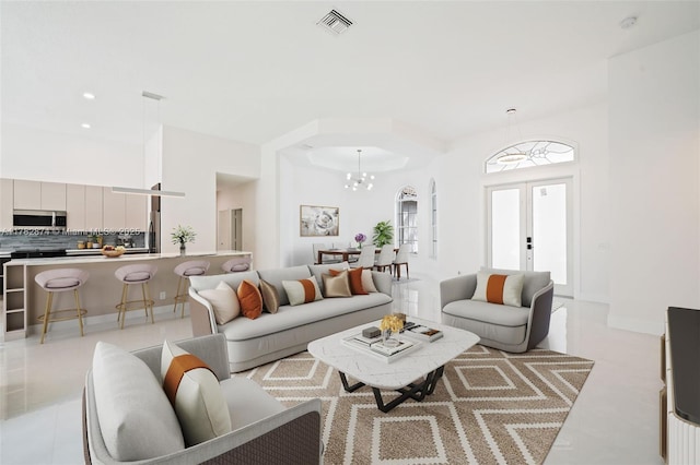 1807 Victoria Pointe Cir, Weston, FL 33327 - living room featuring a chandelier, french doors, and recessed lighting