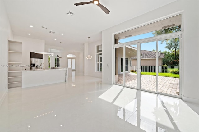 1807 Victoria Pointe Cir, Weston, FL 33327 - unfurnished living room featuring a ceiling fan, tile patterned flooring, and recessed lighting
