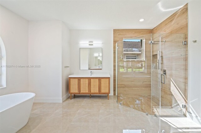 1807 Victoria Pointe Cir, Weston, FL 33327 - full bathroom featuring vanity, marble tiled floors, a freestanding tub, a shower stall, and recessed lighting