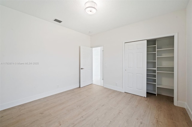 1807 Victoria Pointe Cir, Weston, FL 33327 - unfurnished bedroom featuring wood finished floors, baseboards, and a closet
