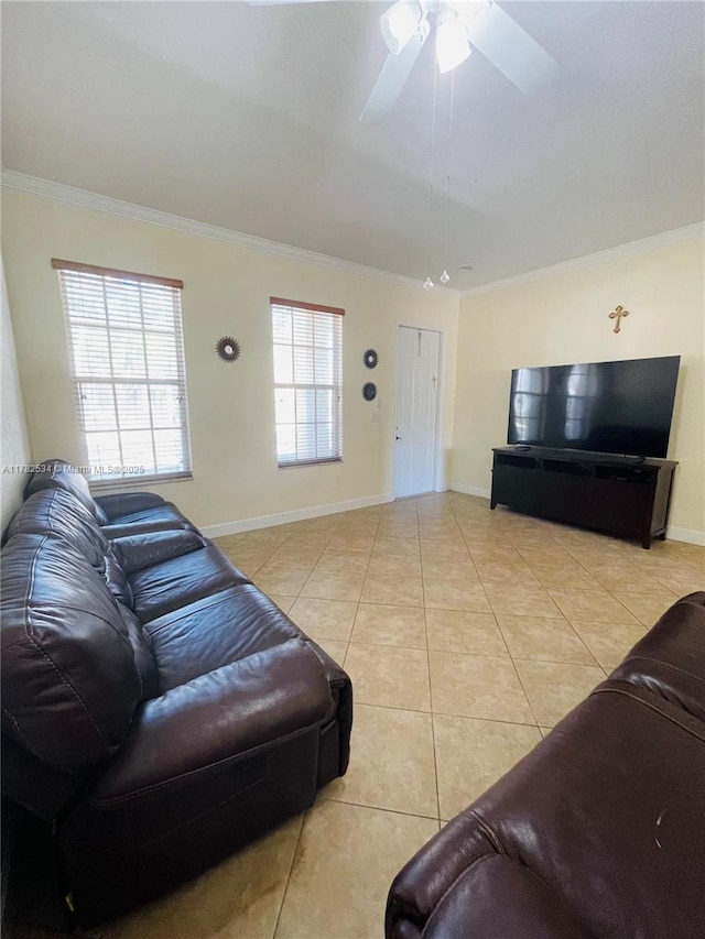 tiled living room featuring baseboards, ornamental molding, and ceiling fan