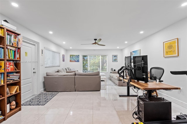 living area with light tile patterned floors, baseboards, a ceiling fan, and recessed lighting