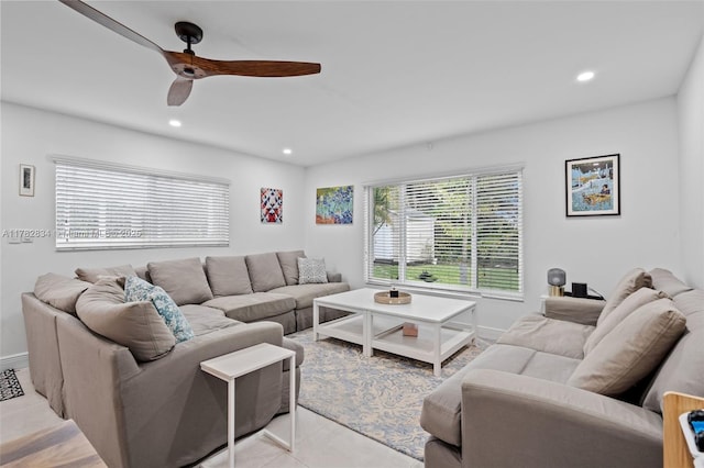living area with baseboards, a ceiling fan, light tile patterned flooring, and recessed lighting