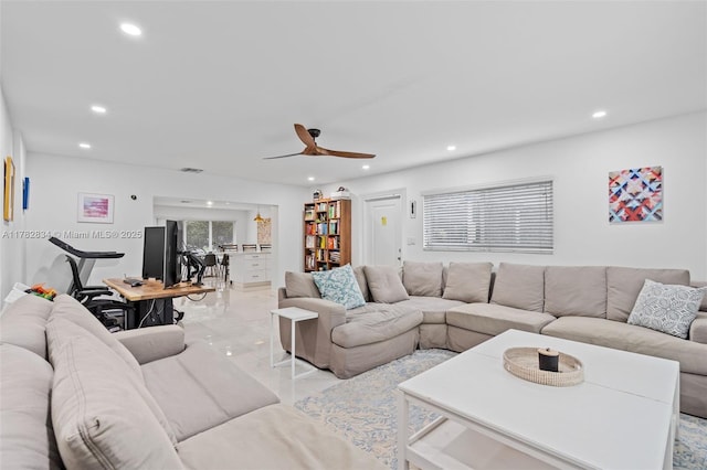 living area with visible vents, ceiling fan, recessed lighting, and marble finish floor