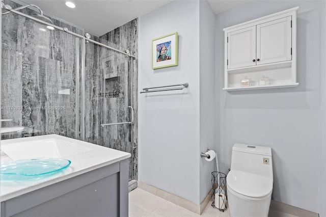 full bath with a shower stall, vanity, tile patterned flooring, and toilet