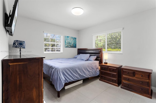 bedroom with light tile patterned floors