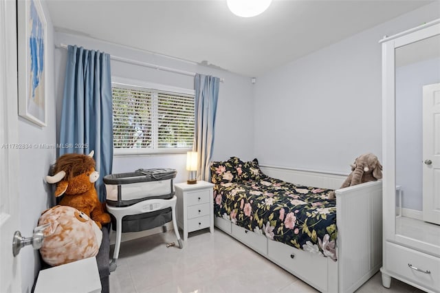 bedroom with light tile patterned flooring