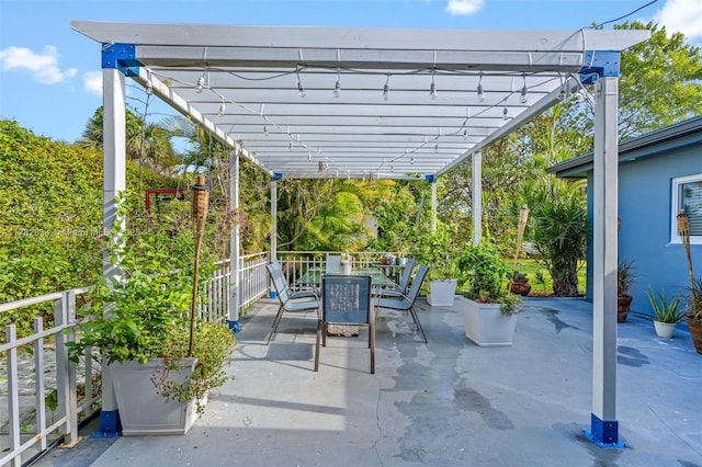 view of patio featuring a pergola and outdoor dining area