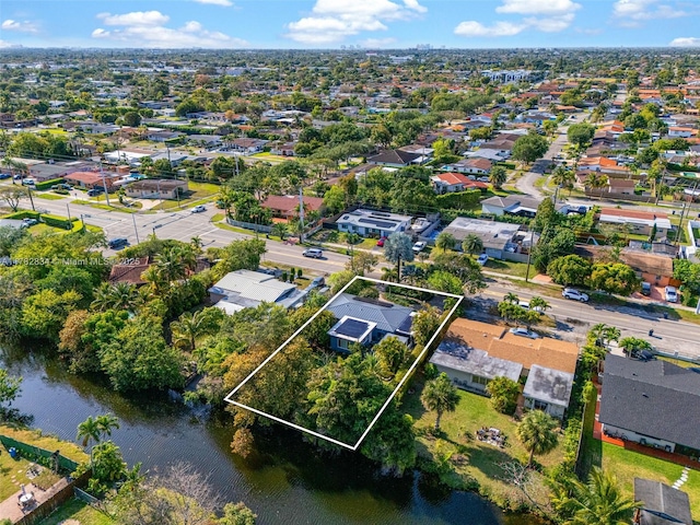 drone / aerial view featuring a water view and a residential view