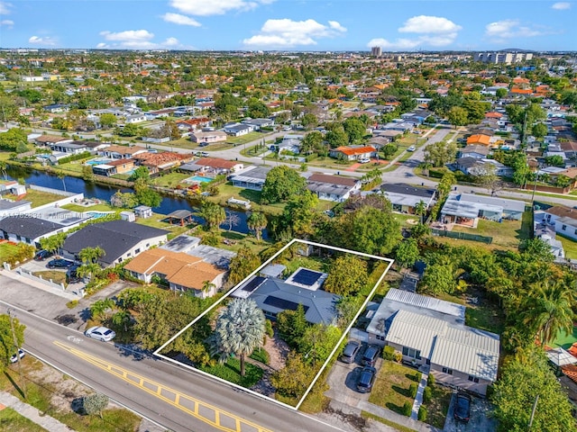aerial view with a residential view and a water view