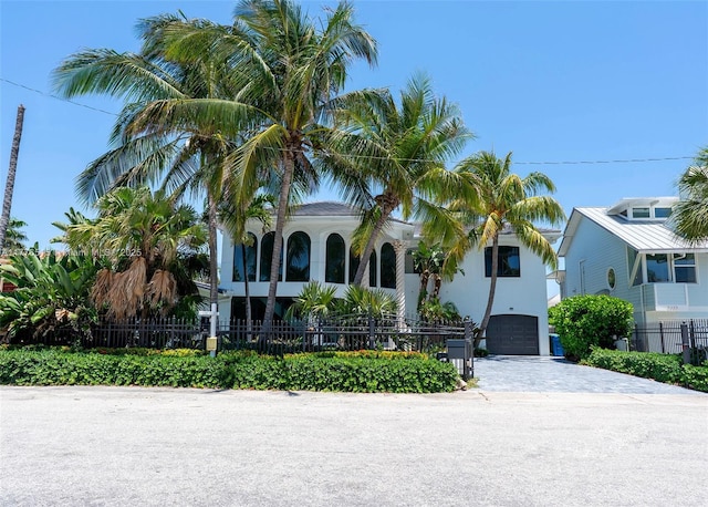 3321 NE 16th Pl, Fort Lauderdale, FL 33305 - view of front of property with driveway, a garage, and stucco siding