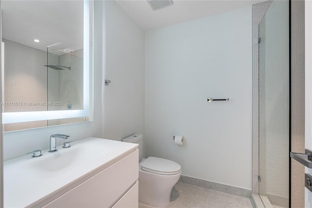3321 NE 16th Pl, Fort Lauderdale, FL 33305 - full bath featuring walk in shower, toilet, vanity, and baseboards