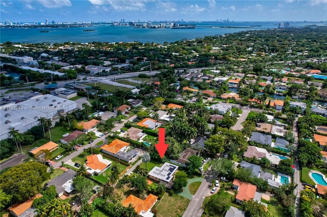 bird's eye view featuring a water view, a residential view, and a view of city