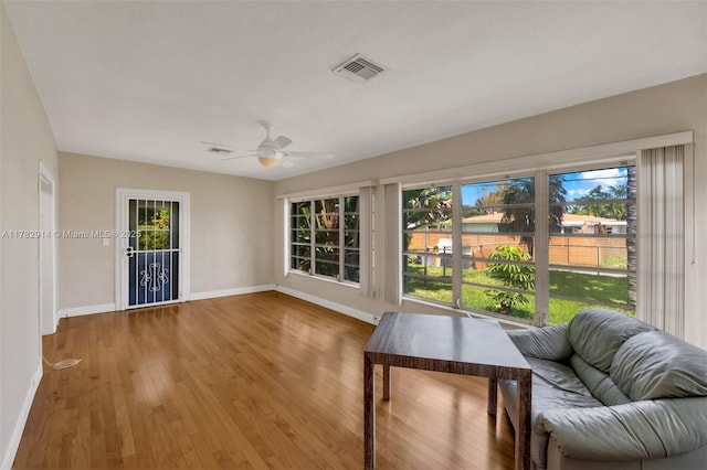 sunroom / solarium with a healthy amount of sunlight and visible vents