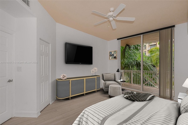 3001 NE 185th St Unit 336, Aventura, FL 33180 - bedroom with access to outside, baseboards, visible vents, light wood-style floors, and a wall of windows
