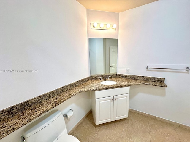 3001 NE 185th St Unit 336, Aventura, FL 33180 - half bathroom with tile patterned flooring, vanity, baseboards, and toilet