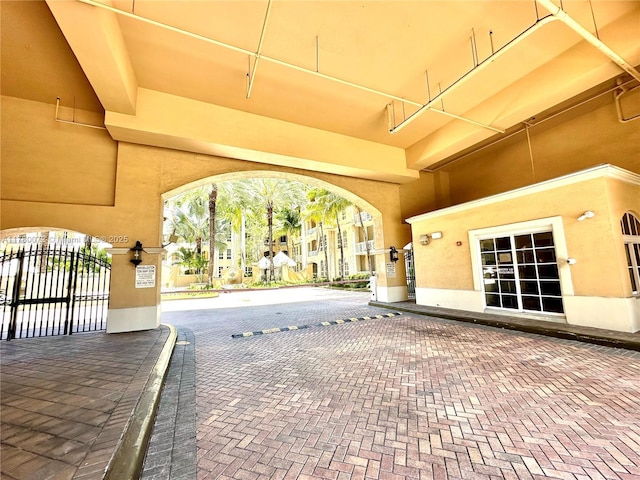 3001 NE 185th St Unit 336, Aventura, FL 33180 - exterior space with a gate and stucco siding