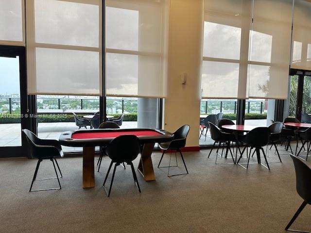 dining space with carpet