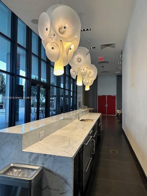 welcome area with a sink and visible vents