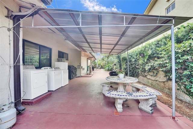view of patio featuring washer and clothes dryer