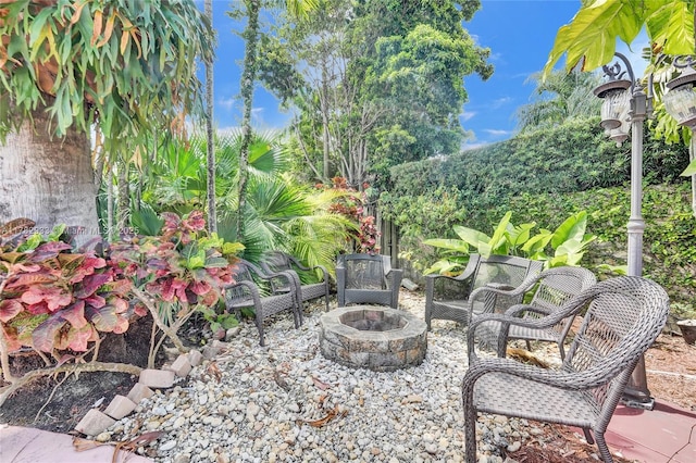 view of patio with a fire pit