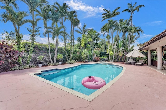view of pool with a fenced in pool and a patio